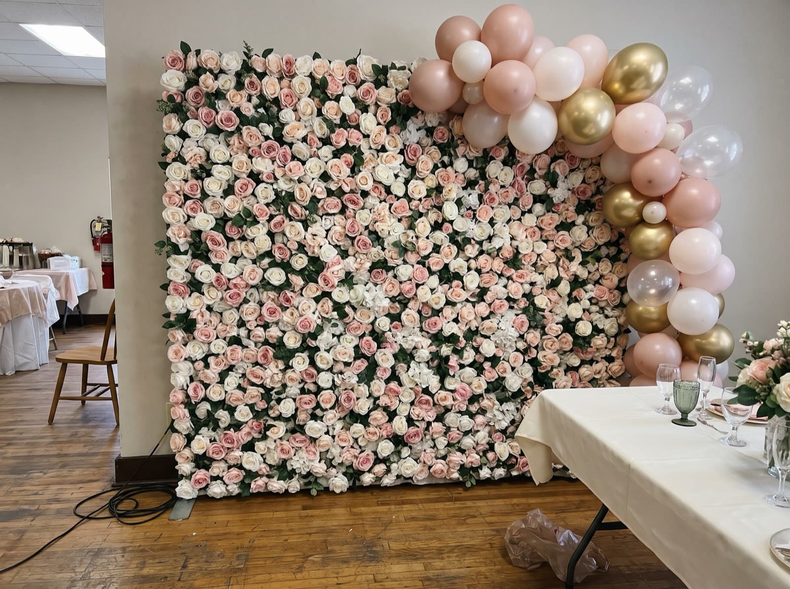 Flower wall backdrop with blush balloons