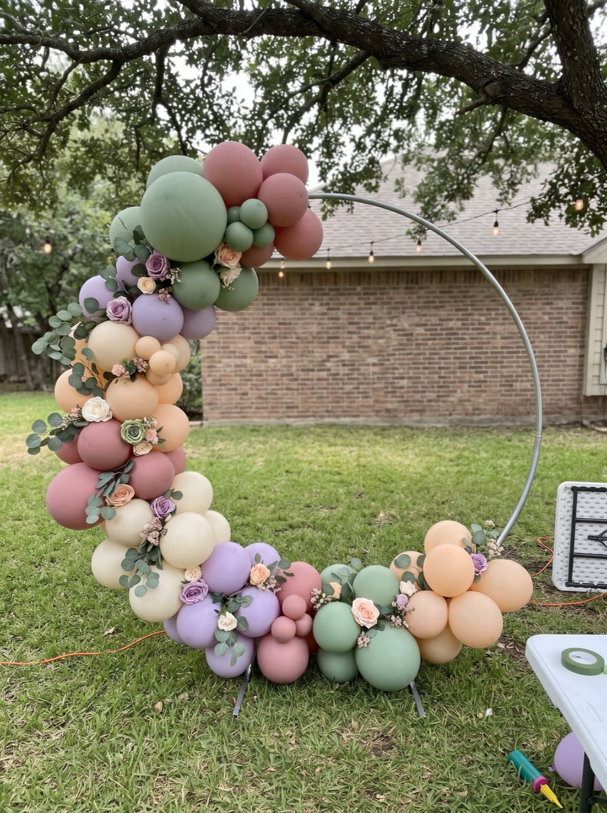 Balloon hoop backdrop with florals