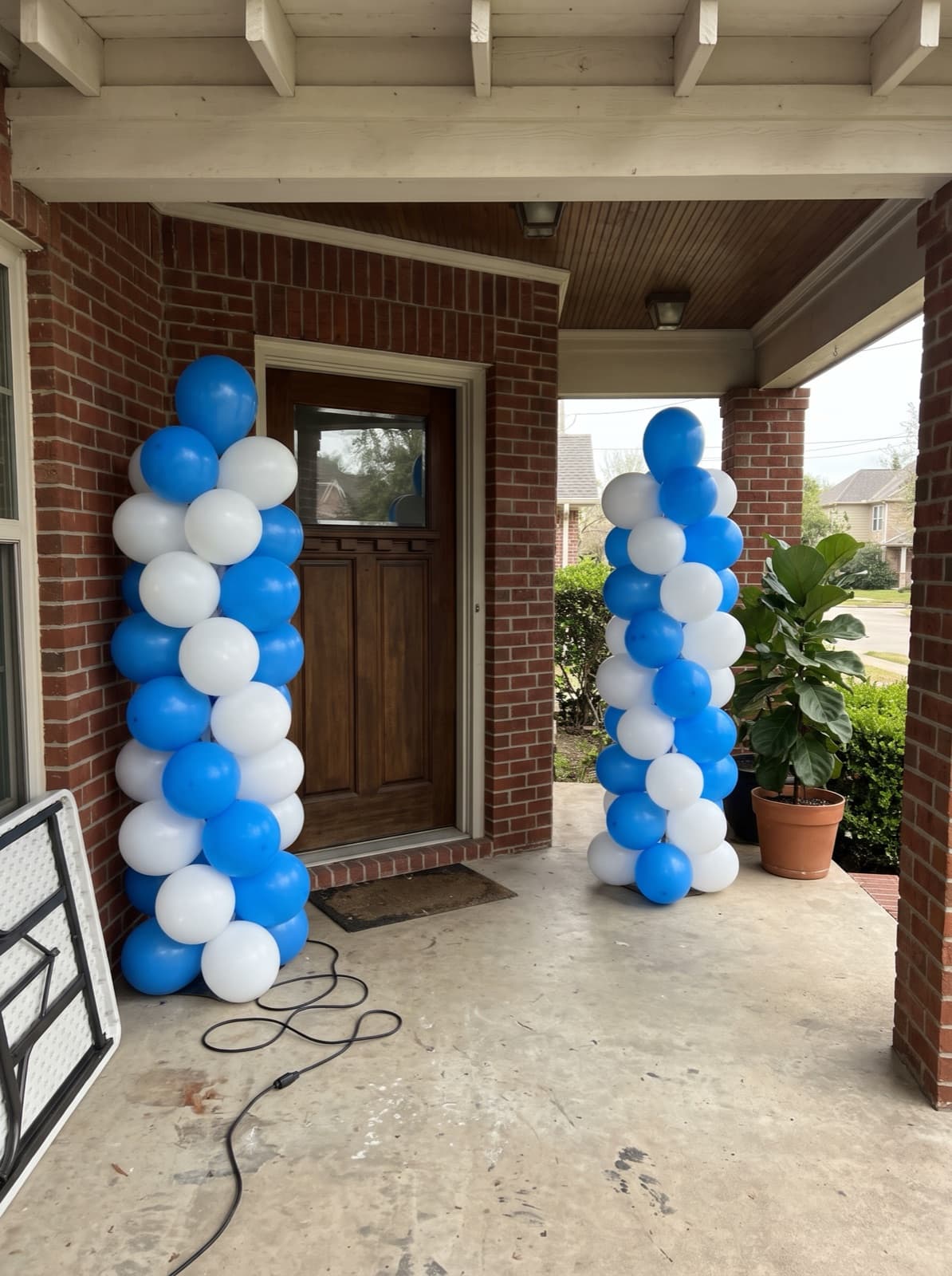 Pair of spiral balloon columns at a front door