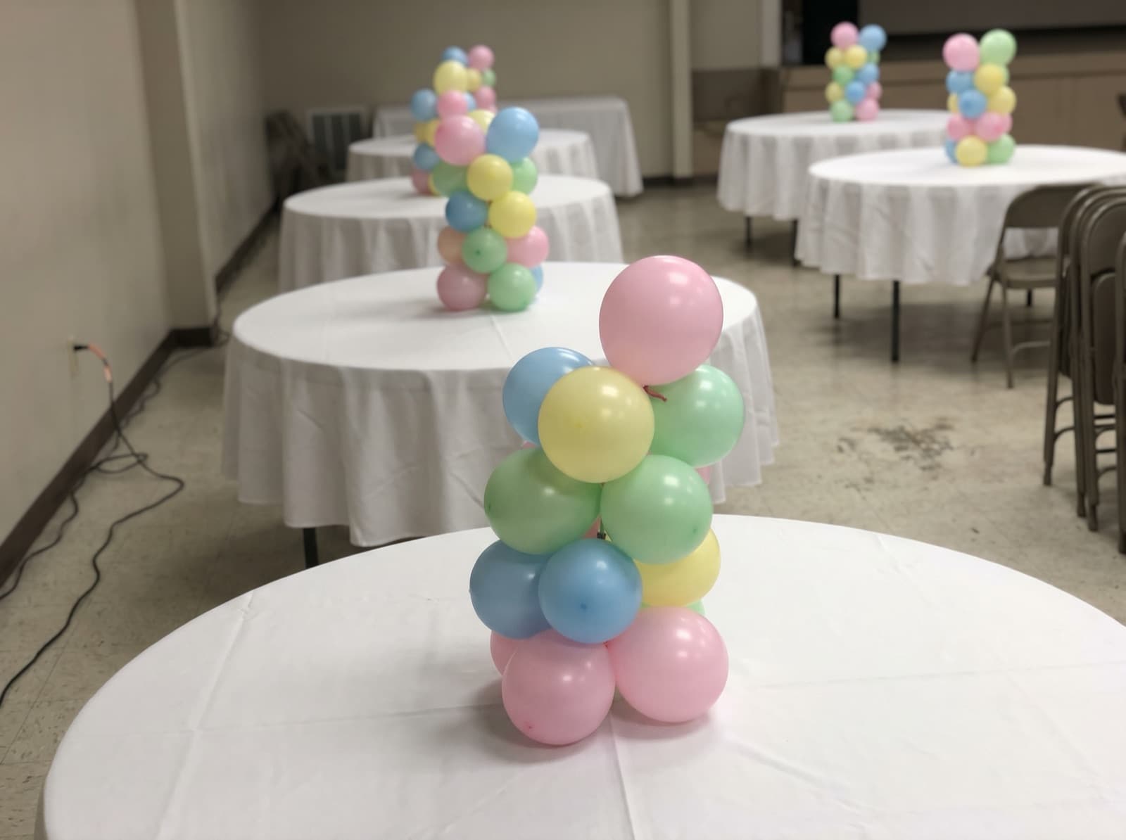 Mini tabletop balloon columns as centerpieces