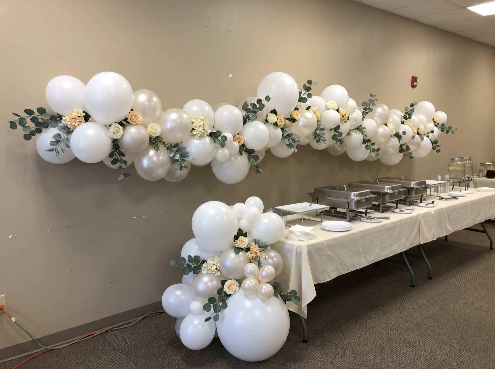 Balloon garland with eucalyptus and silk flowers