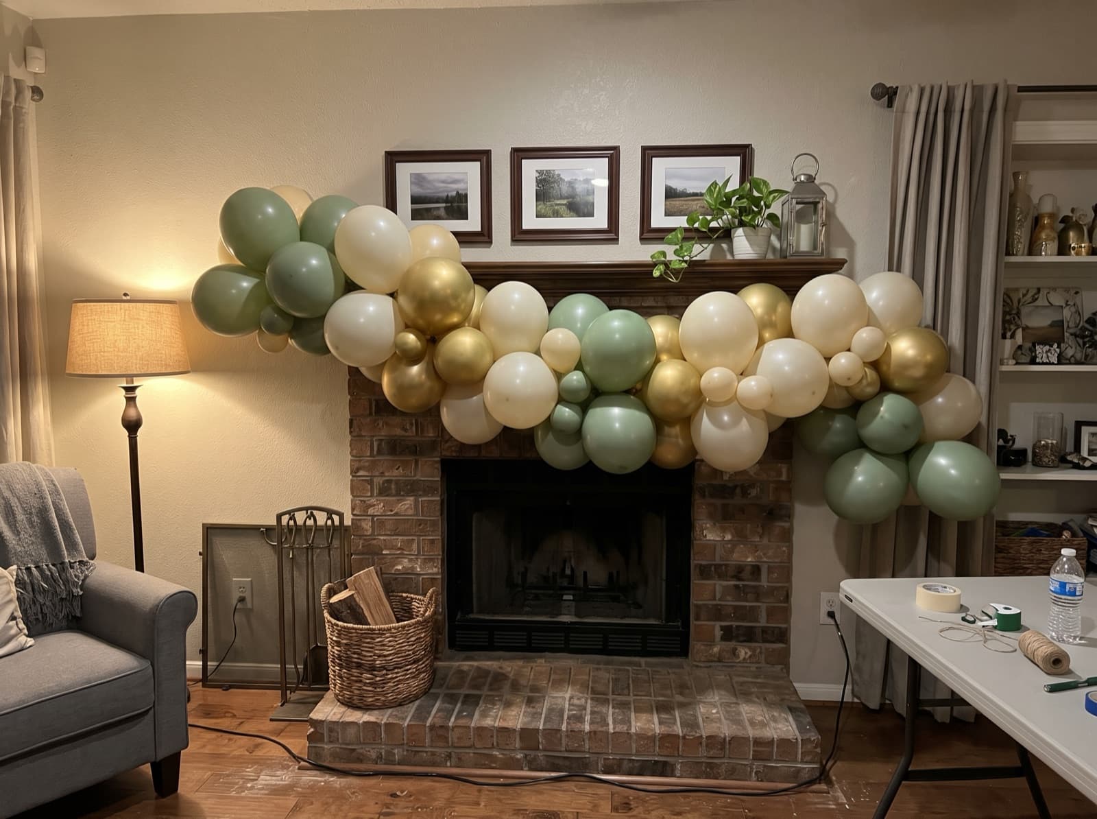 Organic balloon garland along a fireplace mantel