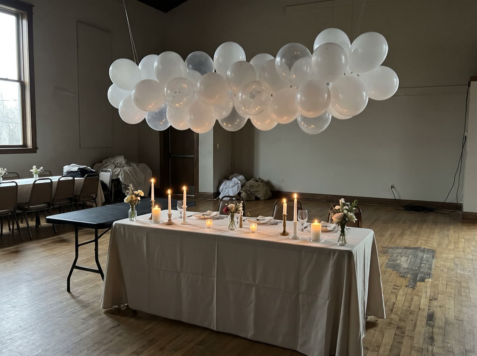 Balloon cloud over a sweetheart table