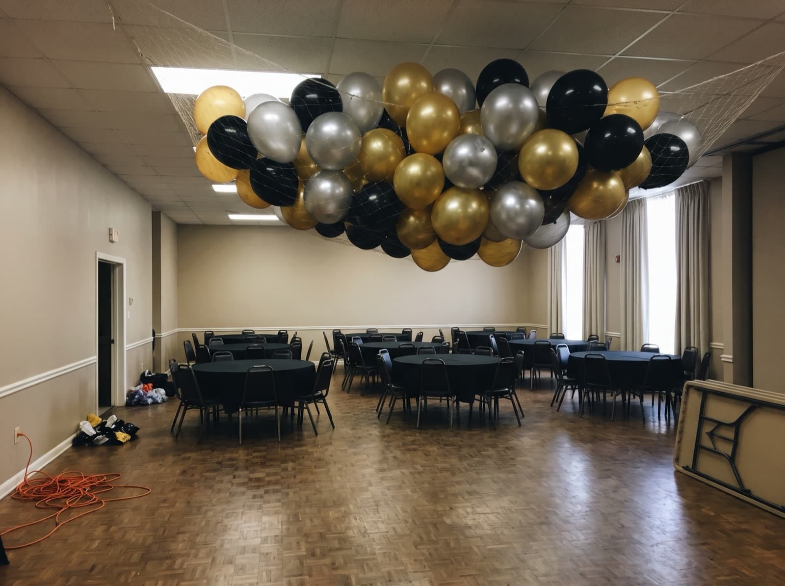 Balloon drop net overhead before a countdown