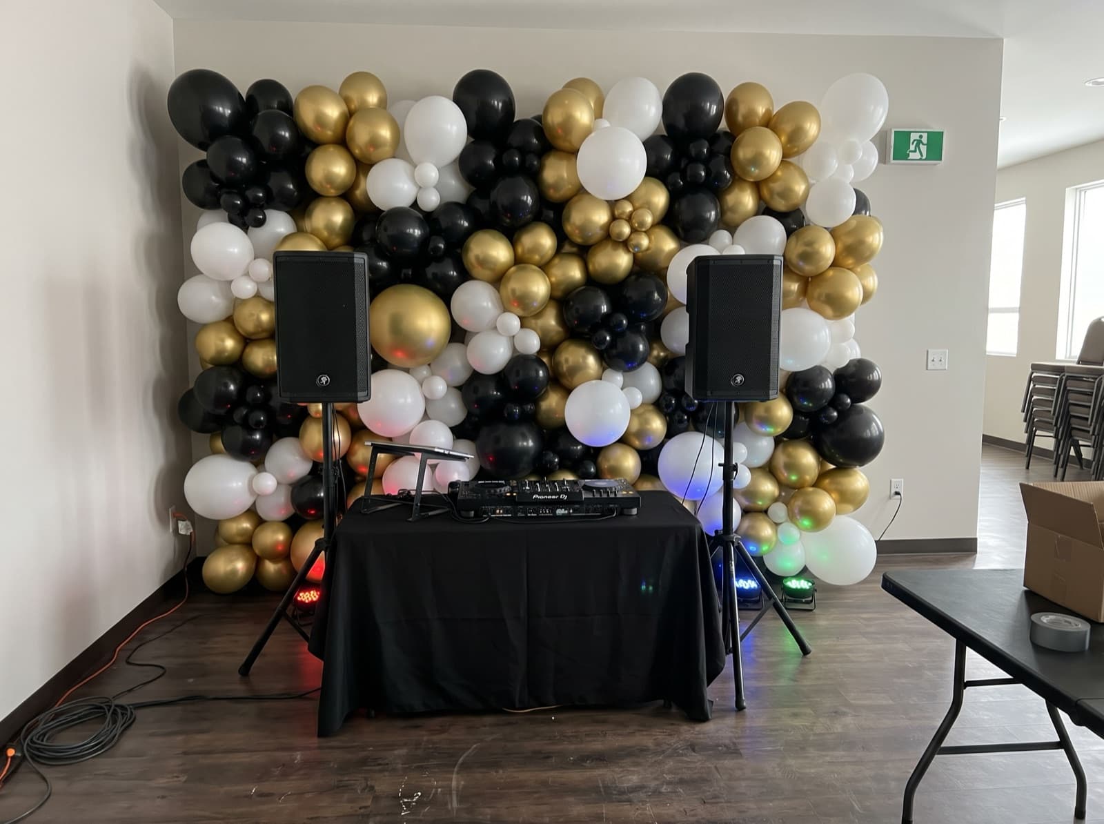 Balloon wall behind a DJ booth