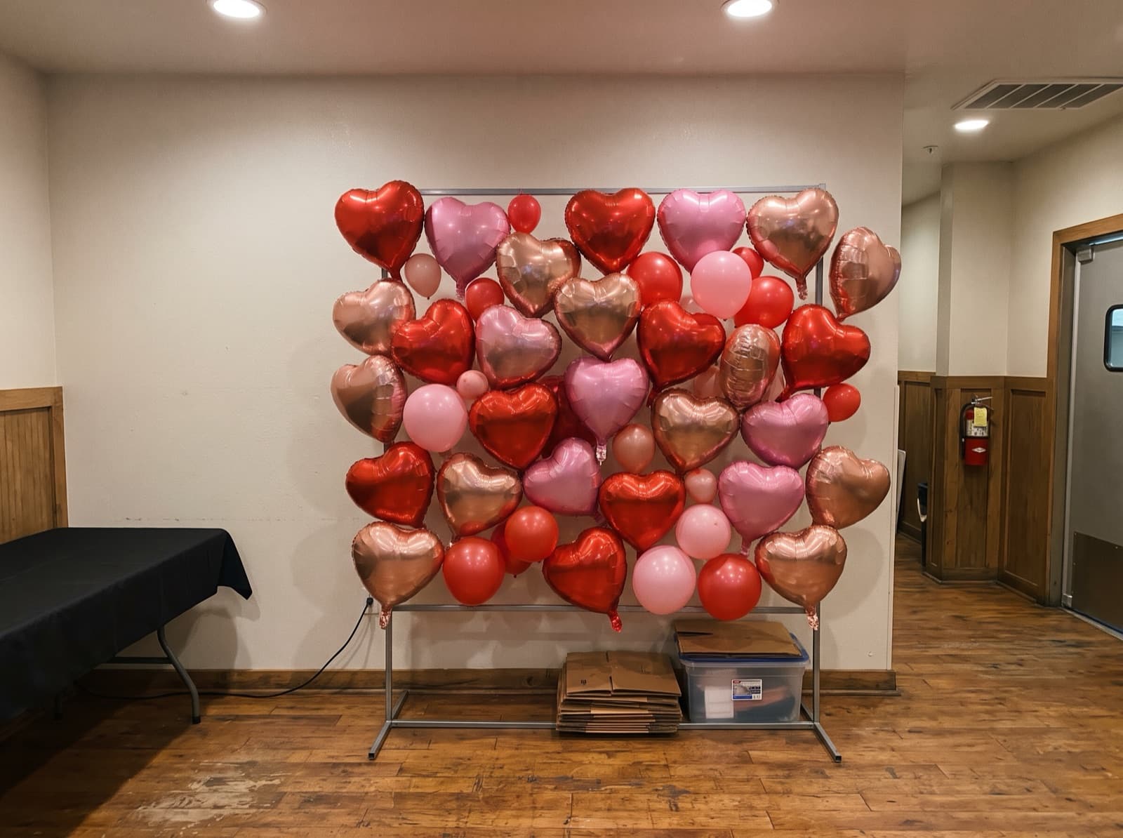Foil heart balloon wall in red and pink