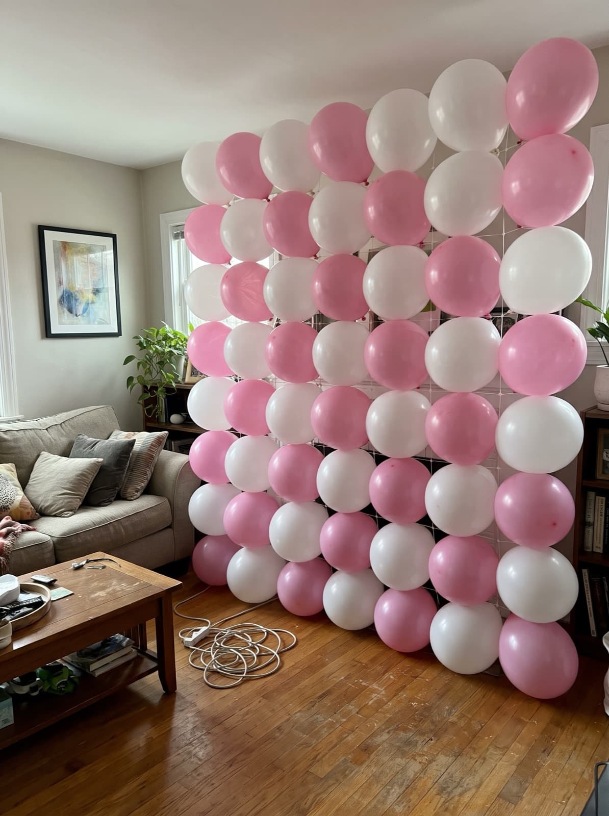 Grid balloon wall in a pink and white checkerboard